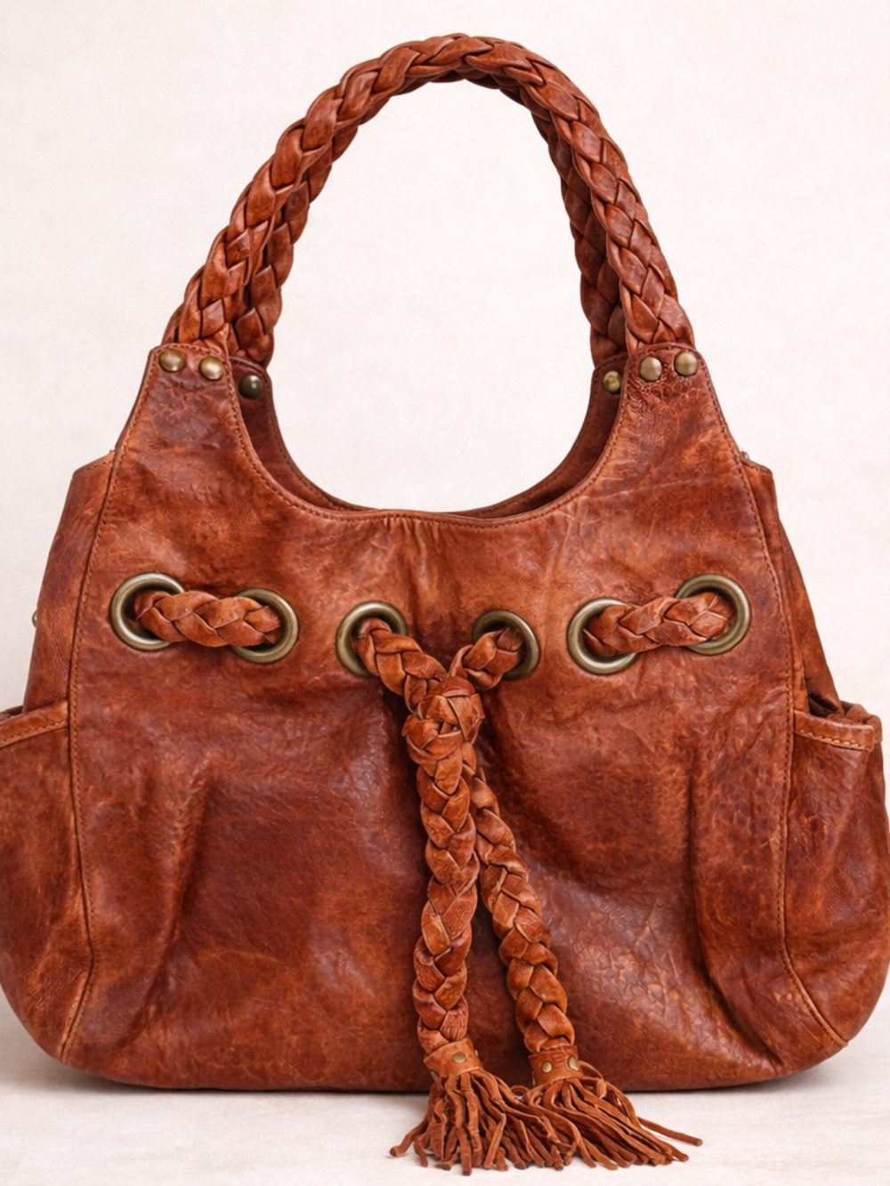 Kooba “Carla” light brown leather shoulder bag‎ w/braiding detail & side pockets